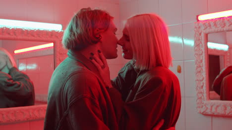 Sensual-Couple-Kissing-in-Room-with-Red-Neon-Light